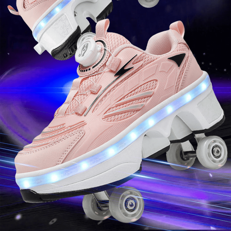 angled view of pink LED roller skate shoes with twist lock dial system and glowing LED midsole
