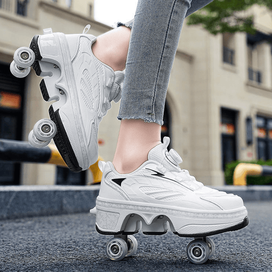 outdoor close-up of white LED roller shoes for women gliding on city street pavement