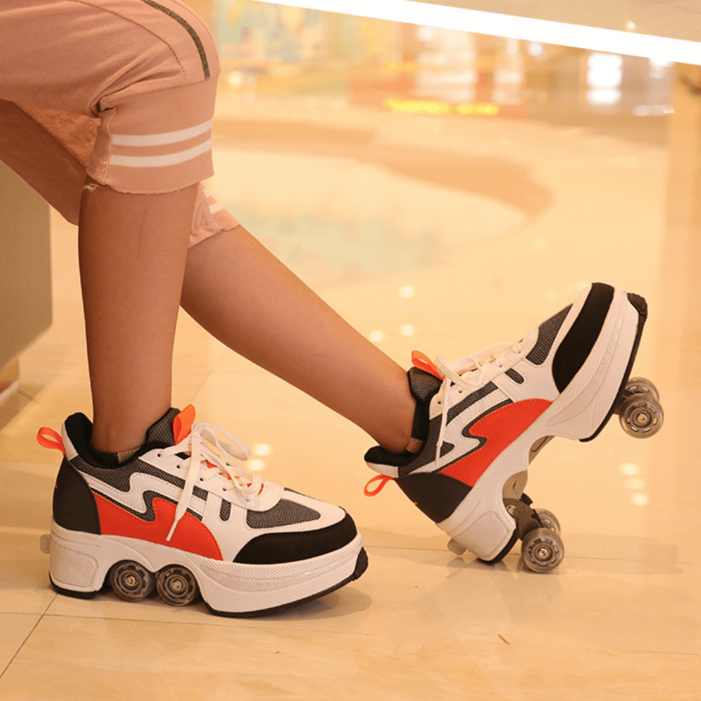 woman wearing orange and white shoes with pop-up wheels standing indoors on glossy floor