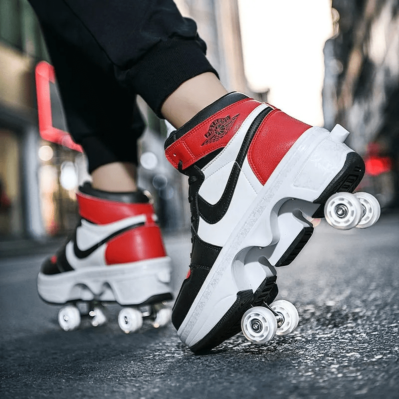 low-angle close-up of red kick speed roller shoes on street asphalt