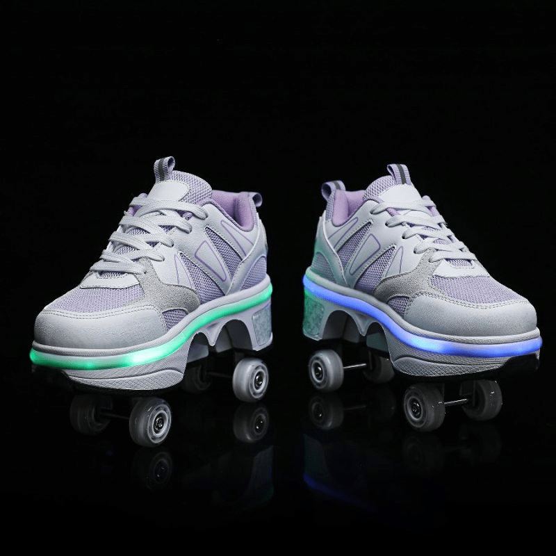 front view of shoes with wheels for girls purple LED glowing on street, studio photo on black background
