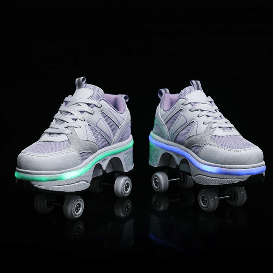 front view of shoes with wheels for girls purple LED glowing on street, studio photo on black background
