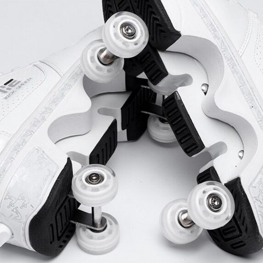 close-up view of retractable wheel system under Kick Speed white roller skate shoes, showing sole and wheel detail