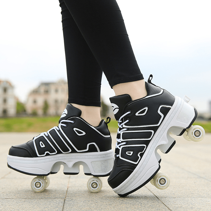 black roller skate shoes with pop-out wheels for adults outdoor close-up on pavement