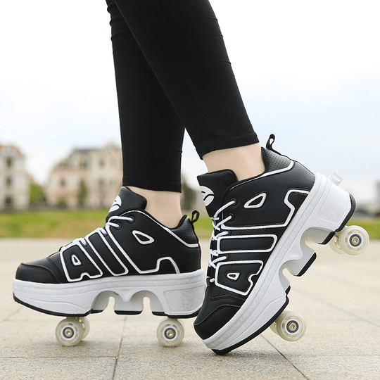 black roller skate shoes with pop-out wheels for adults outdoor close-up on pavement
