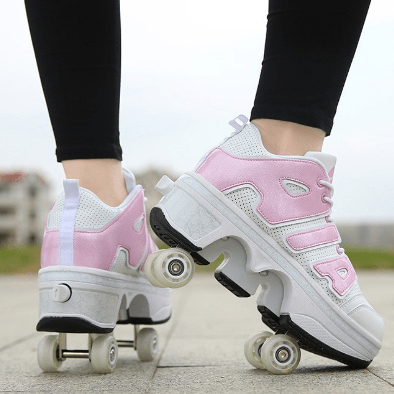 pink and white 4 wheel shoes for kids outdoor lifestyle shot back view