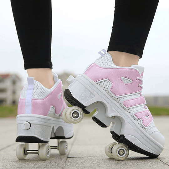 pink and white 4 wheel shoes for kids outdoor lifestyle shot back view