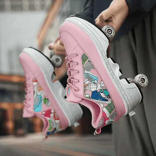pair of pink roller skate shoes with wheels, held by hand, side view