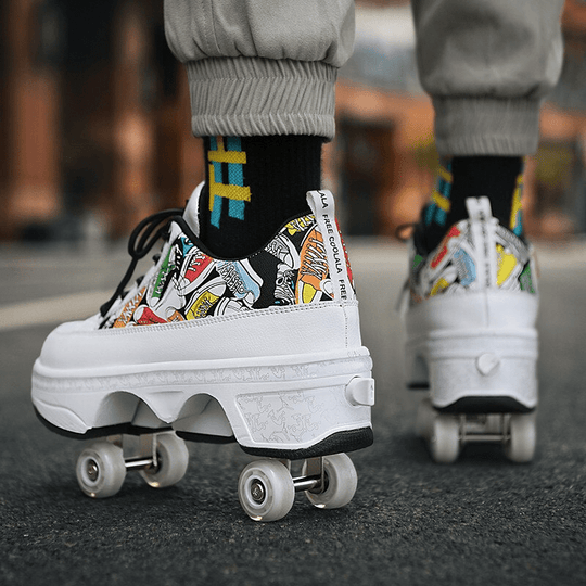 back angle of white roller shoes with comic art print, person skating outside